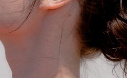 Close up of a woman's neck and ear