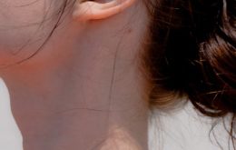 Close up of a woman's neck and ear