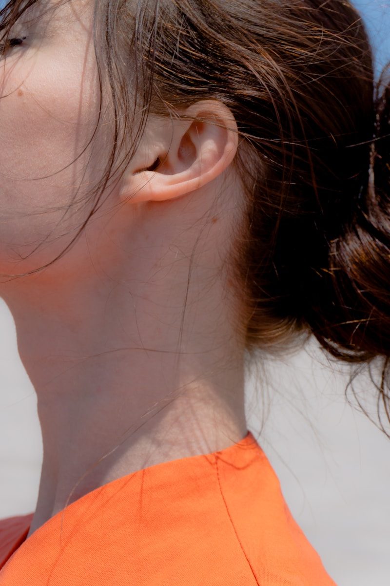 Close up of a woman's neck and ear